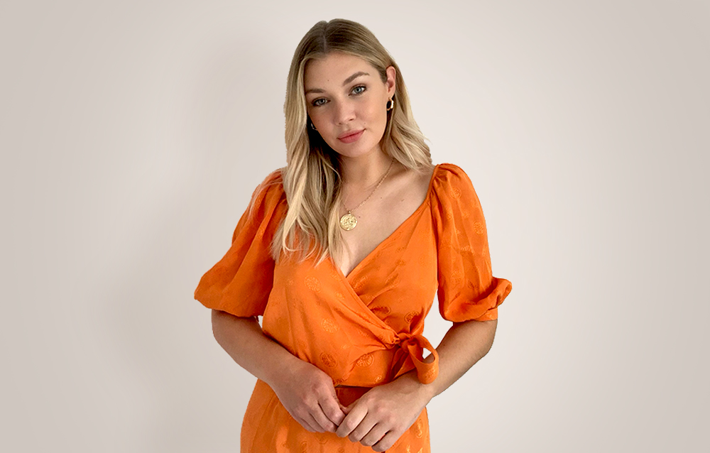 Female model photoshoot in orange dress