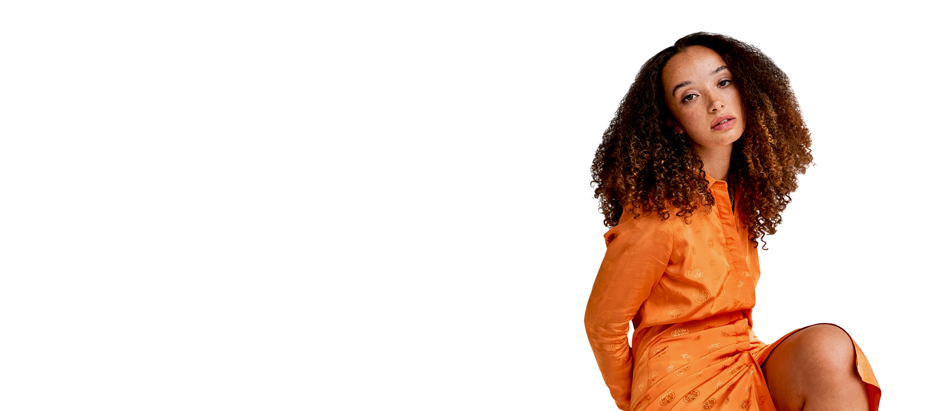 female model wearing orange rayon dress